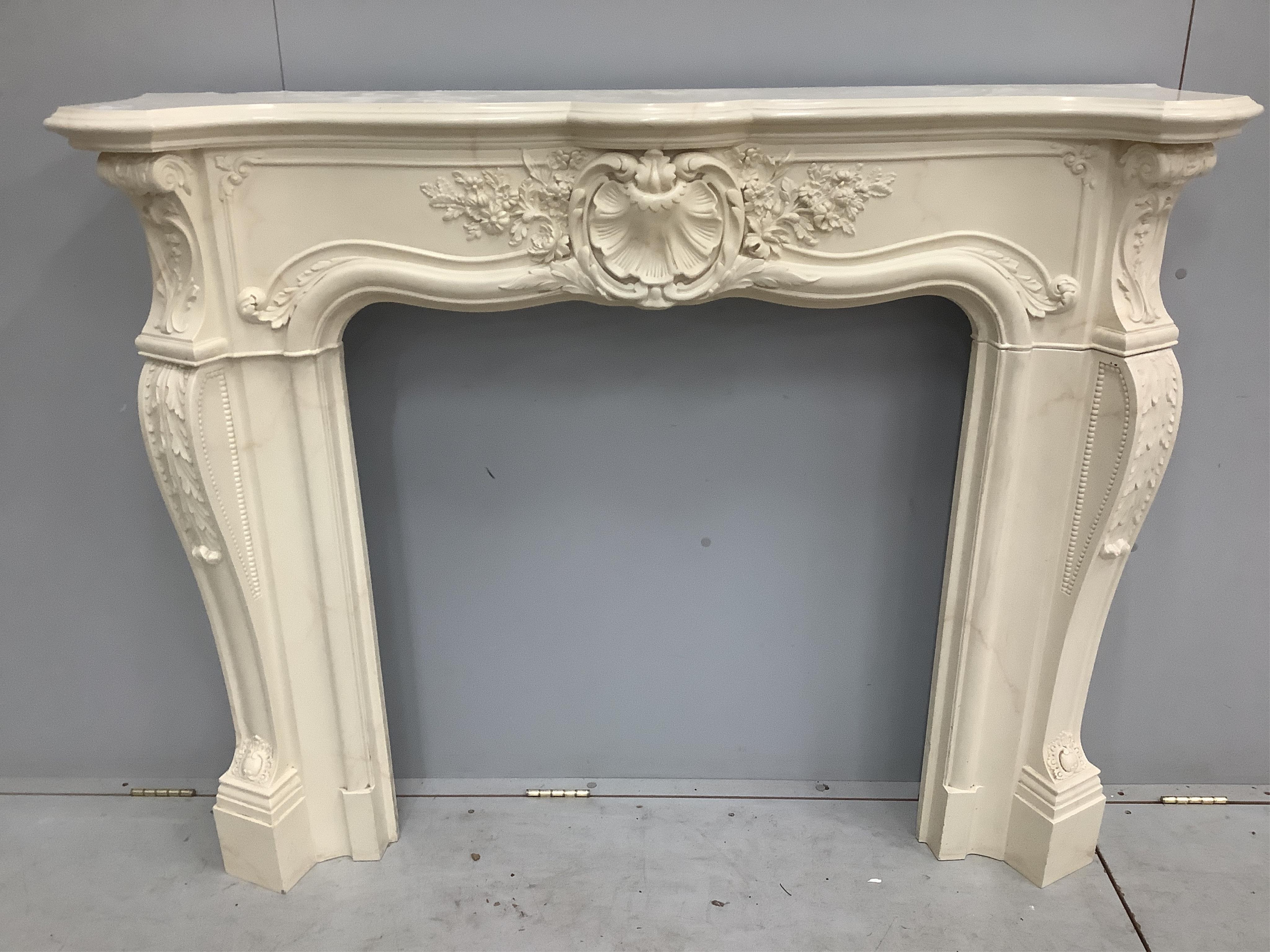 An 18th century style cast composition faux marble fire surround, width 142cm, height 115cm. Condition - fair to good